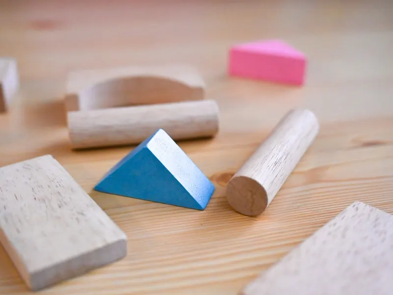 A wooden stacking and sorting toy
