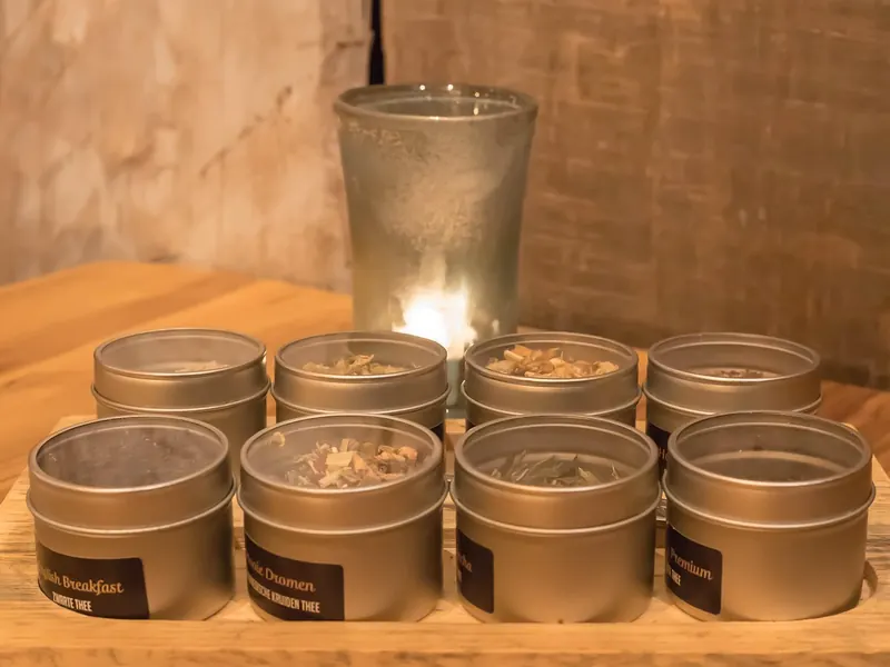A hand-poured candle in a tin