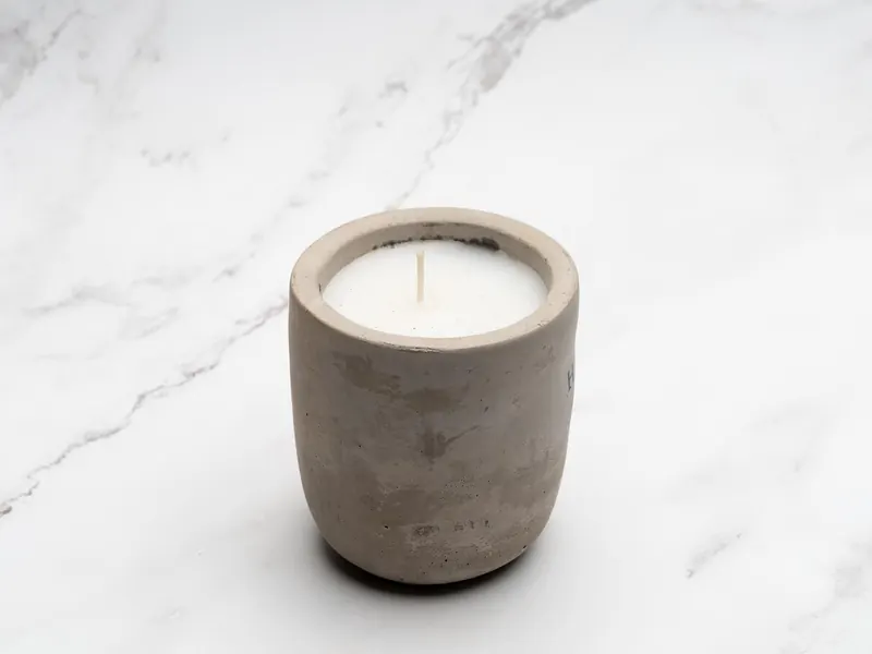 A scented candle in a neutral fragrance